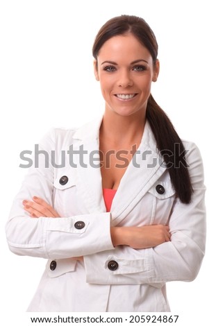 Portrait of happy young confident woman standing arms crossed, smiling, looking at camera.