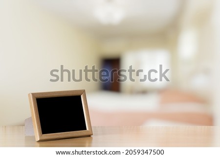 photo frame on the wooden table in the bedroom
