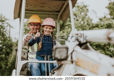 Contractor father and daughter at a construction site