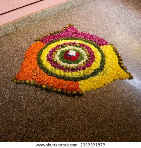 A closeup shot of a colorful garden mockup doormat on a brown ceramic floor