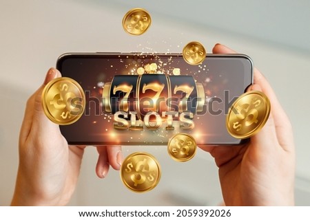 Online casino, smartphone with slot machine with jackpot and gold coins. Online Slots, Lucky Seven 777, Dark Gold Style. Luck concept, gambling, jackpot, banner Royalty-Free Stock Photo #2059392026