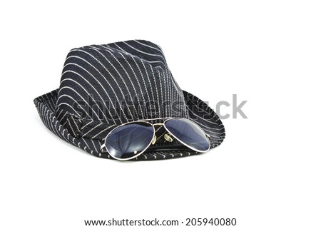 black fedora hat and sunglasses on white background