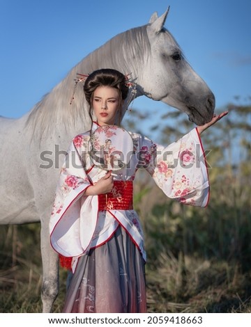 Girl in kimono with white free horse