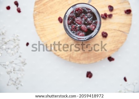 Healthy fermented honey product with cranberry. Food preservative at home, cozy, rustic flat lay. Delicious recipe concept. Anti-viral food.