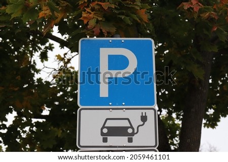 Sign for parking lot with car charger