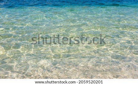 Transparent blue sea water, natural background
