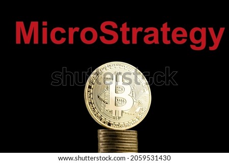 Bitcoin BTC representation coin with MicroStrategy text in background. Royalty-Free Stock Photo #2059531430