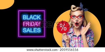 Excited surprised pinup beautiful woman in red glasses with % procent text. Pin up shocked girl with open mouth. Blond model - retro fashion and vintage ad concept. Black Friday sales neon light sign.