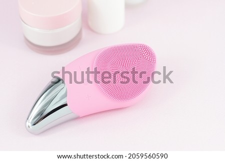 Pink sonic facial massage brush 