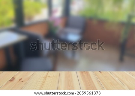 Empty Wood Plate Top Table On Abstract Blurred Background Of Coffee Shop