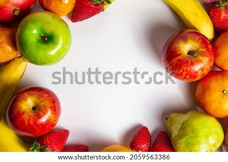 Assorted fresh fruits with white background.