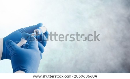 Focus on vaccine, doctor or nurse hands taking covid vaccination booster shot Royalty-Free Stock Photo #2059636604