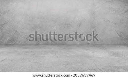 Empty gray Wall Room interiors studio concrete Backdrop and Rough floor cement shelf, well editing montage Display products and text present on free space cement Background