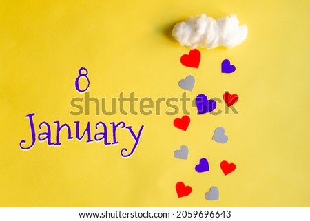 8 january day of month, colorful hearts rain from white cotton cloud on yellow background. Valentine's day, love and wedding concept