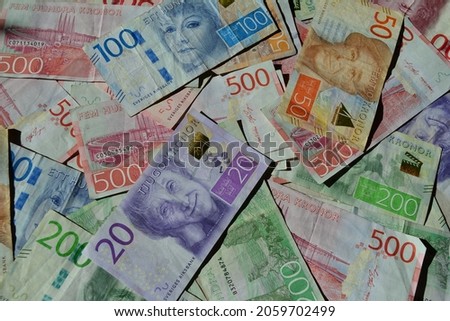 A top view of colorful Swedish krona banknotes Royalty-Free Stock Photo #2059702499
