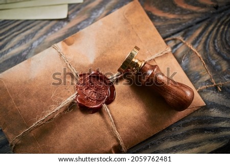 Sealing wax on ancient papers, antique stamp, and old documents, brass spoon  Royalty-Free Stock Photo #2059762481