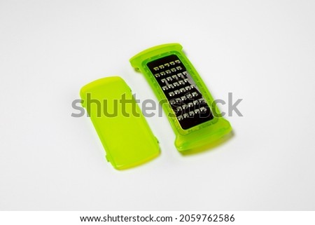Grater for vegetables isolated on white background.High-resolution photo.Mock-up