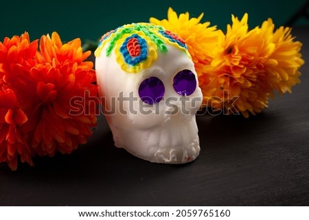 Sweet mexican sugar skull and marigold flowers background. Day of the dead concept