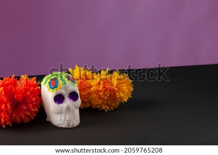 Sweet mexican sugar skull and marigold flowers background. Day of the dead concept
