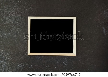 Christmas, New Year flat lay on black background.  Wooden writing board close up. Top view. Copy space. Mock up. Template. Business ideas. Place for text. 