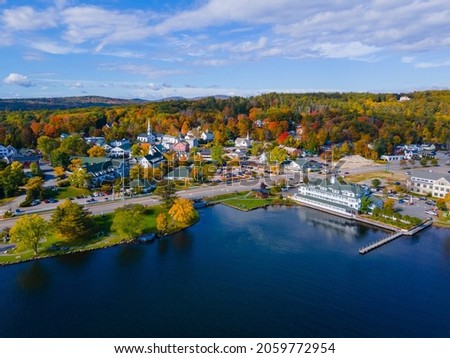 Meredith town center with fall foliage aerial view in fall with Meredith Bay in Lake Winnipesaukee, New Hampshire NH, USA.  Royalty-Free Stock Photo #2059772954