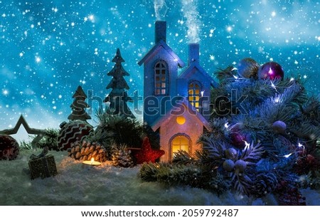 Beautiful christmas texture with a house and christmas deco in the night
