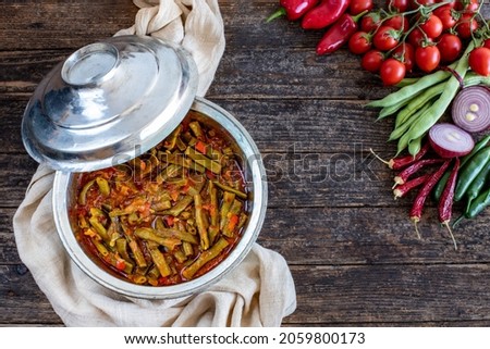 Green beans cooked with olive oil . Vegan and vegetarian food.  Royalty-Free Stock Photo #2059800173
