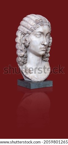 Copy of an antique female statue isolated on a red background. Design element with clipping path