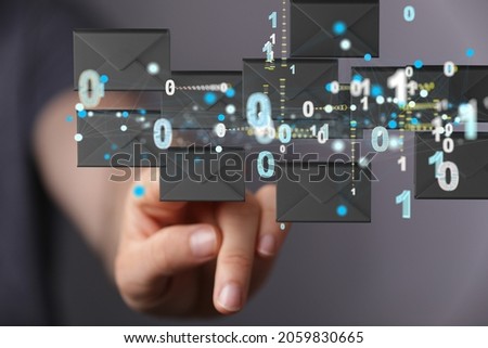 A person presenting the virtual projection of electronic mail icons with binary numbers