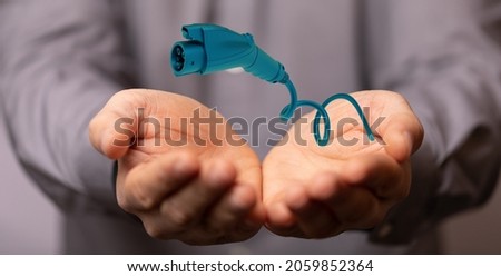 A 3D rendering of Electric car charger floating over hands-Future Power concept