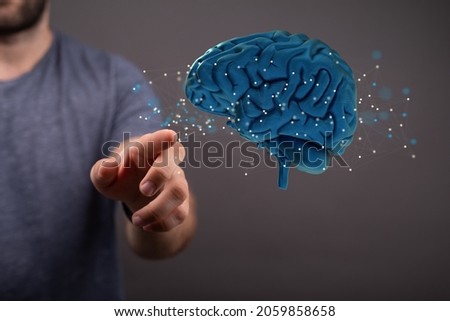 A 3D rendering of digital brain with hand touching it from behind-brain network and digital IQ concept