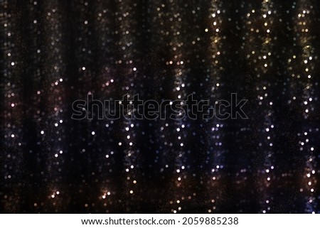 unfocused multicolored lights on a dark background