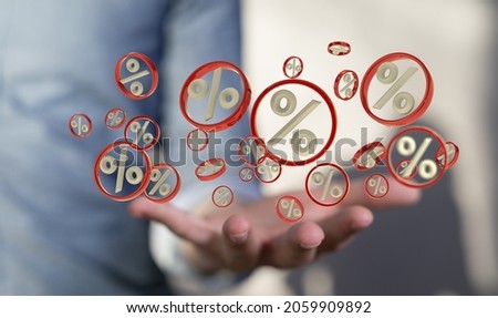 An abstract shot of a man's hand showing 3D rendered percent and sale icons