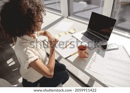 Top view of American woman showing interpreter language to disabled voiceless people while talk on video call Royalty-Free Stock Photo #2059911422