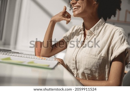  American lady learning and communicating in sign language online in the office