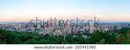 Montreal city skyline panorama at sunset viewed from Mont Royal with urban skyscrapers.