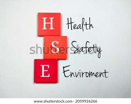 Selective focus.Colored wooden cubes with the letters HSE and the words Health Safety Enviroment