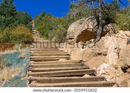 Wooden steps leading up to the top of Manitou Incline. Manitou Springs Incline is a popular hiking trail rising above Manitou Springs, Colorado Royalty-Free Stock Photo #2059951832