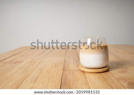 cold latte coffee glass on wood table copy space background Royalty-Free Stock Photo #2059981535