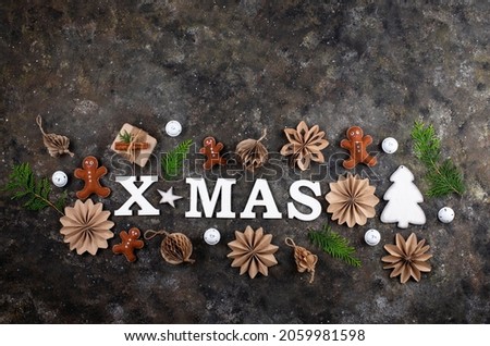 Christmas or New Year winter eco-friendly decoration with wooden letters X-MAS