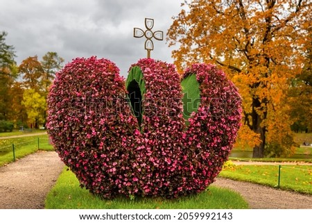 A composition of fresh flowers in the form of an imperial crown in the park of the Gatchina Palace, St. Petersburg