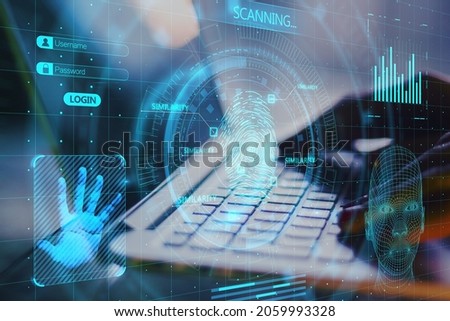 Close up of hands using laptop with abstract glowing finger scanning hologram on dark background. Fingerprint and identity concept. Double exposure