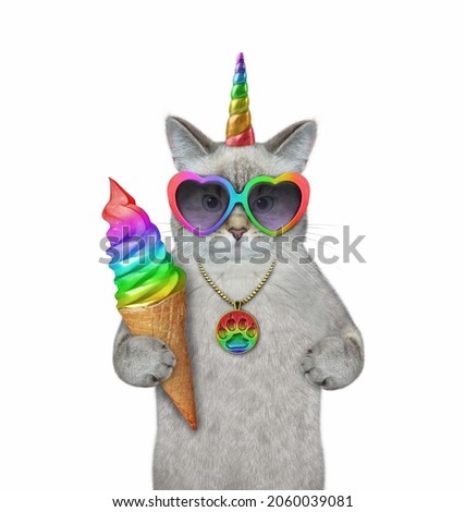 An ash caticorn in heart shaped sunglasses is eating a rainbow ice cream cone. White background. Isolated.