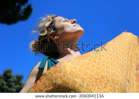 woman outside with pareo in summer
