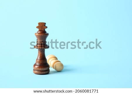 Chess pieces on color background Royalty-Free Stock Photo #2060081771