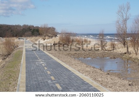 Bicycle lane along the sea. Construction of a bicycle lane. Unfinished pedestrian road. New bicycle lane made of sidewalk tiles.