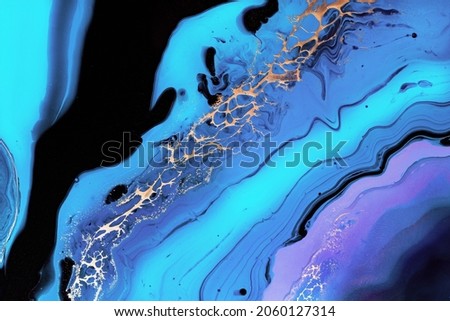 Fluid Art. Liquid Metallic Gold in neon blue wave. Marble effect background or texture