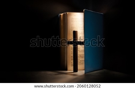 Spirituality, Religion and Hope Concept. Holy Bible and Cross on Desk. Symbol of Humility, Supplication,Believe and Faith for Christian People Royalty-Free Stock Photo #2060128052
