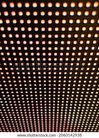 Close-up at illuminate LED screen panel. Abstract background.