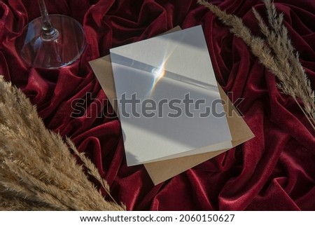 Flat lay composition with blank white paper on brown envelope